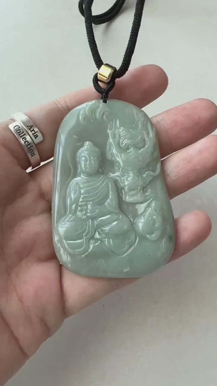 Video of light green semi-translucent jadeite pendant with carved Amitabha Buddha, dragon, and leaf details