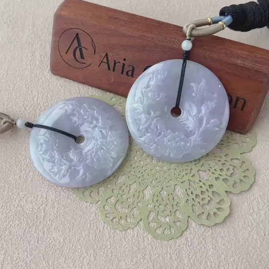 Video of a serene lavender jade donut pendant with smooth circular form, soft translucent tones, and minimalist elegance