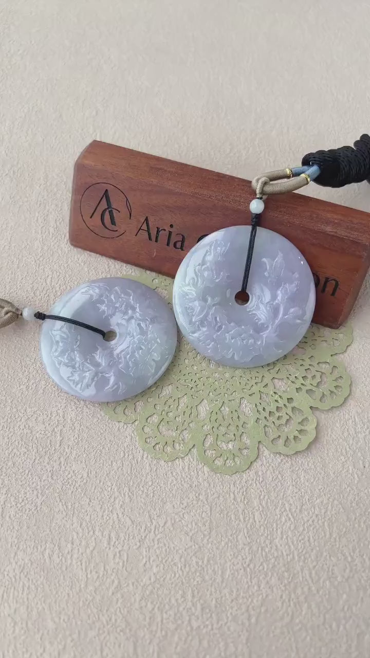 Video of a serene lavender jade donut pendant with smooth circular form, soft translucent tones, and minimalist elegance