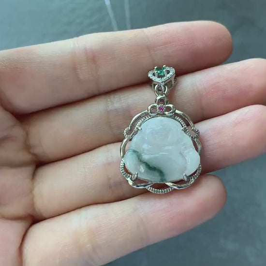 Video of a hand-carved white jadeite Laughing Buddha pendant with dark green streaks and sterling silver crown setting