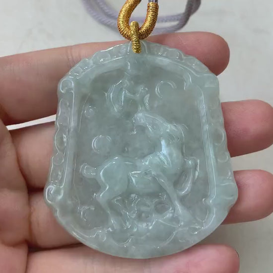 Video of a hand-carved natural jadeite jade horse pendant in green, showcasing fine detail and smooth polished style