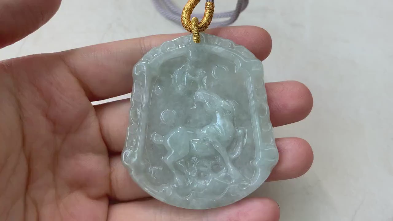 Video of a hand-carved natural jadeite jade horse pendant in green, showcasing fine detail and smooth polished style