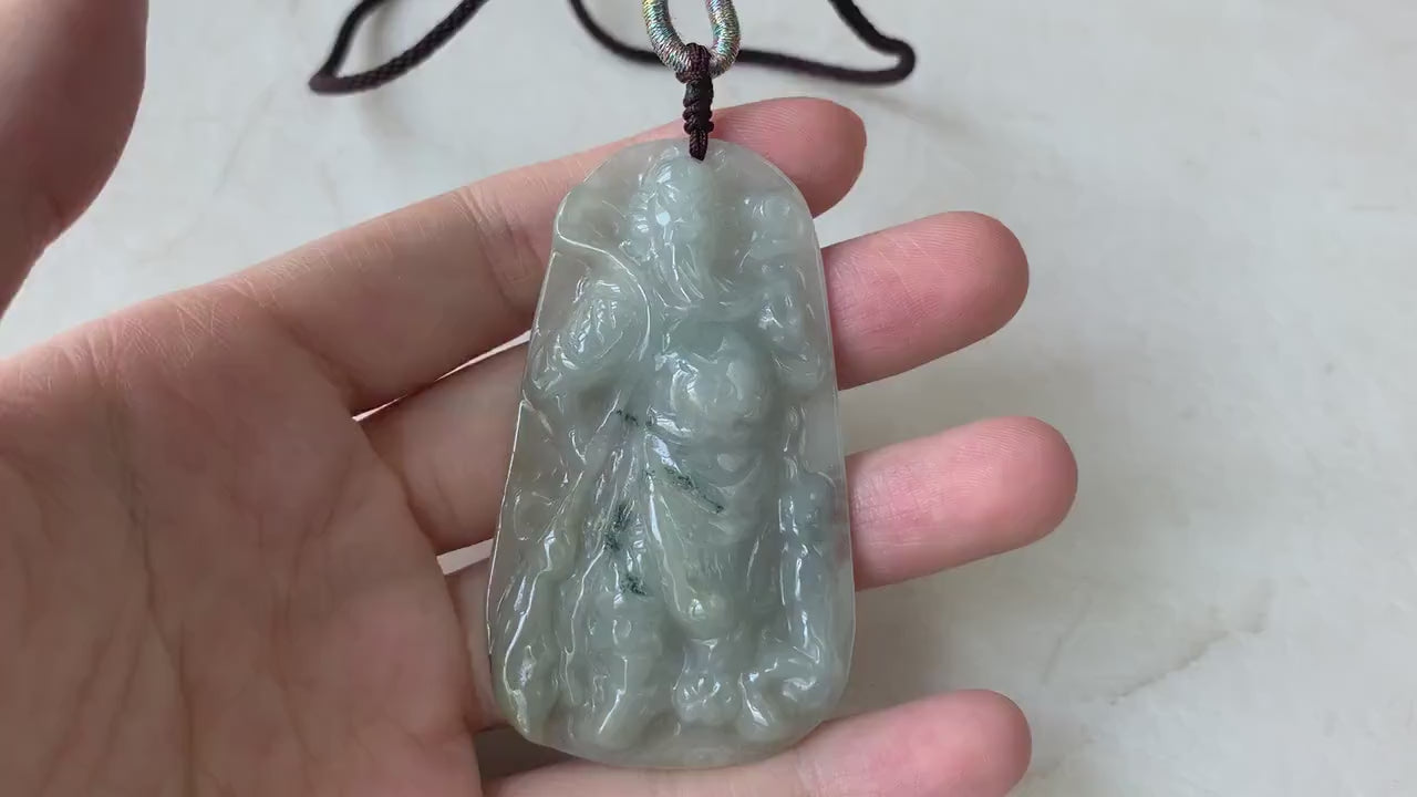 Video of a hand-carved natural jadeite jade Guan Gong pendant in rich green with detailed, artisanal carving