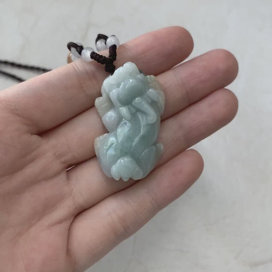 Video of a hand-carved natural Type A jadeite Pi Xiu pendant in rare yellow and green jade tones