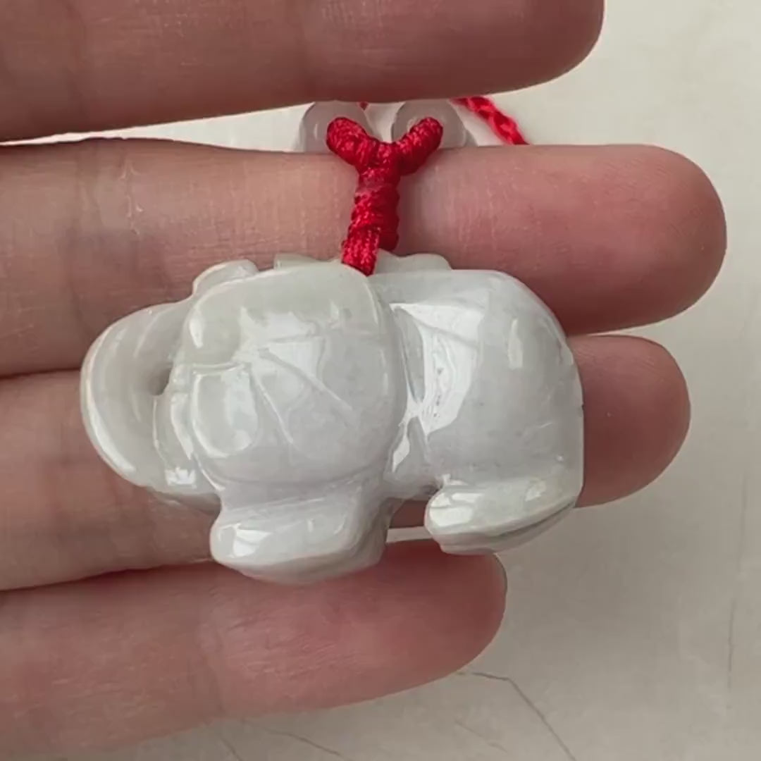 Video of a hand-carved jadeite jade elephant pendant in elegant green with exquisite craftsmanship