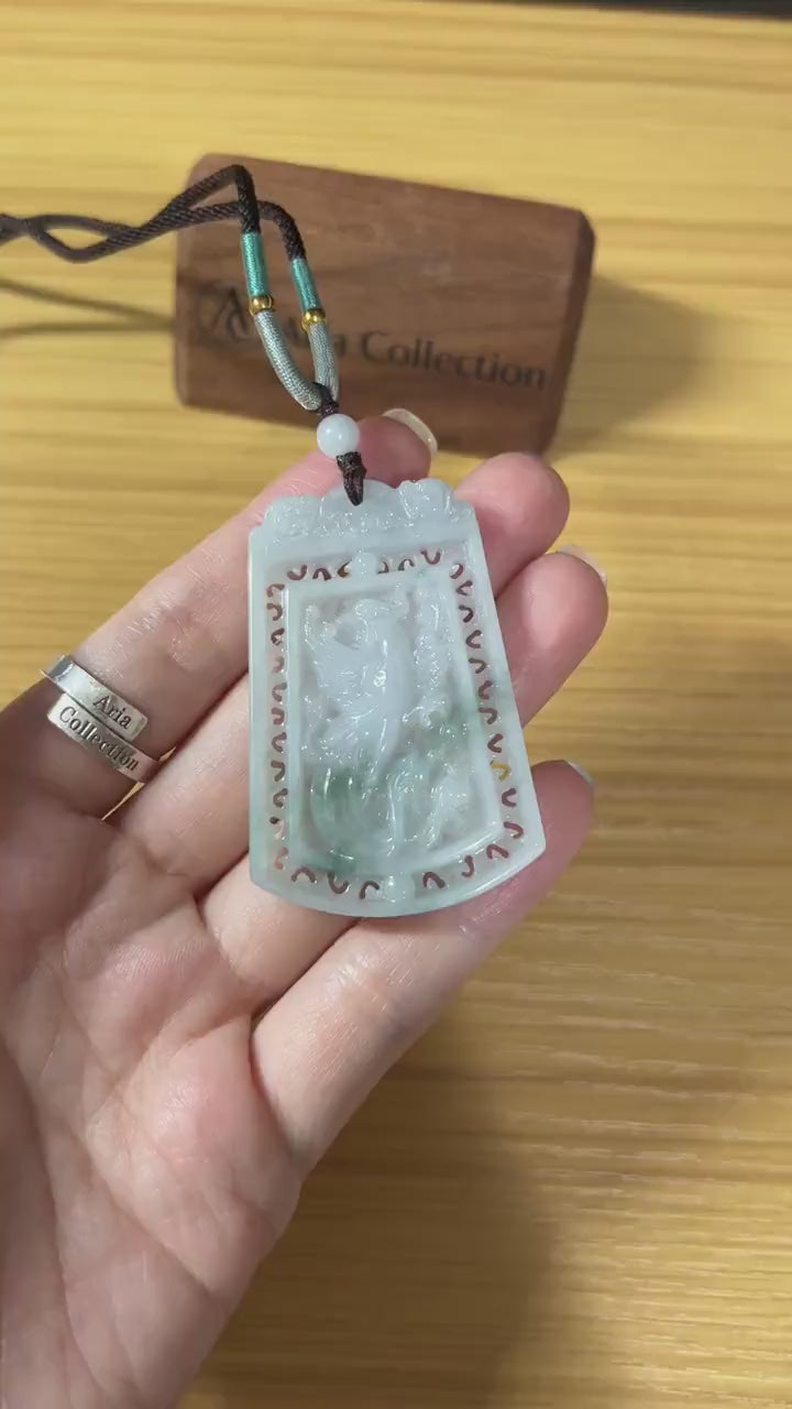 Video of a light green jadeite pendant with intricate hand-carved dragon and phoenix motifs, elegant and rare