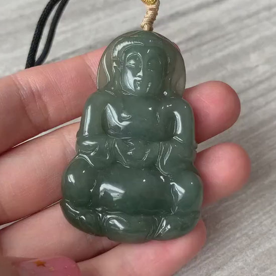 Video of a hand-carved translucent green jadeite Guan Yin lotus pendant with intricate double-sided carving