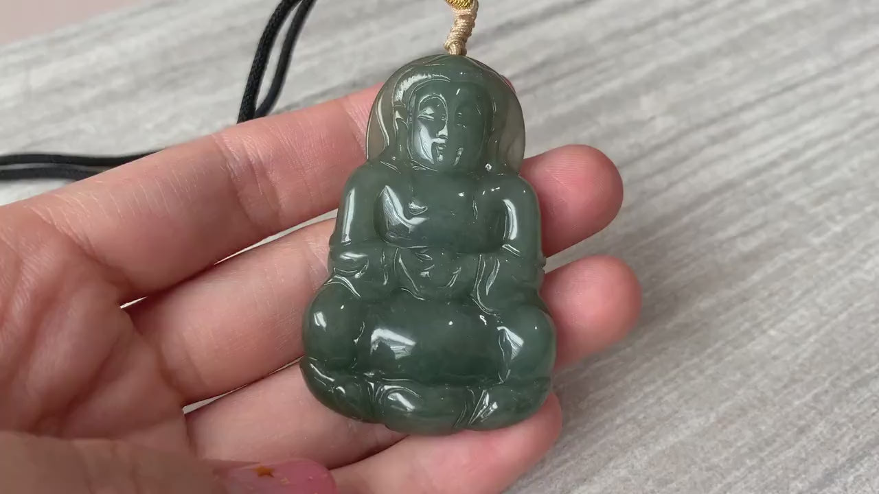 Video of a hand-carved translucent green jadeite Guan Yin lotus pendant with intricate double-sided carving
