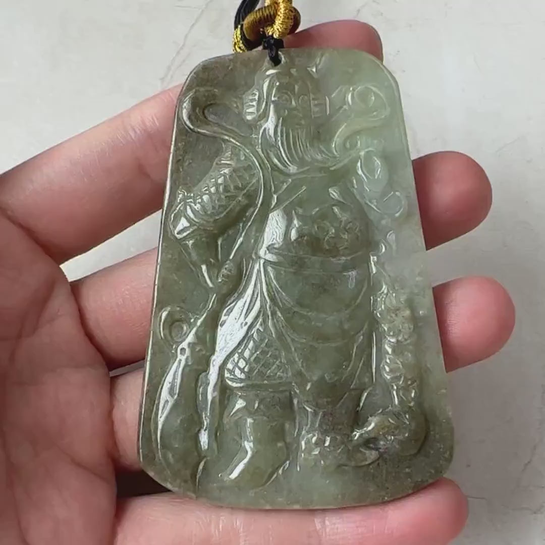 Video of a hand-carved natural jadeite jade Guan Yu pendant in green, traditional and symbolic style