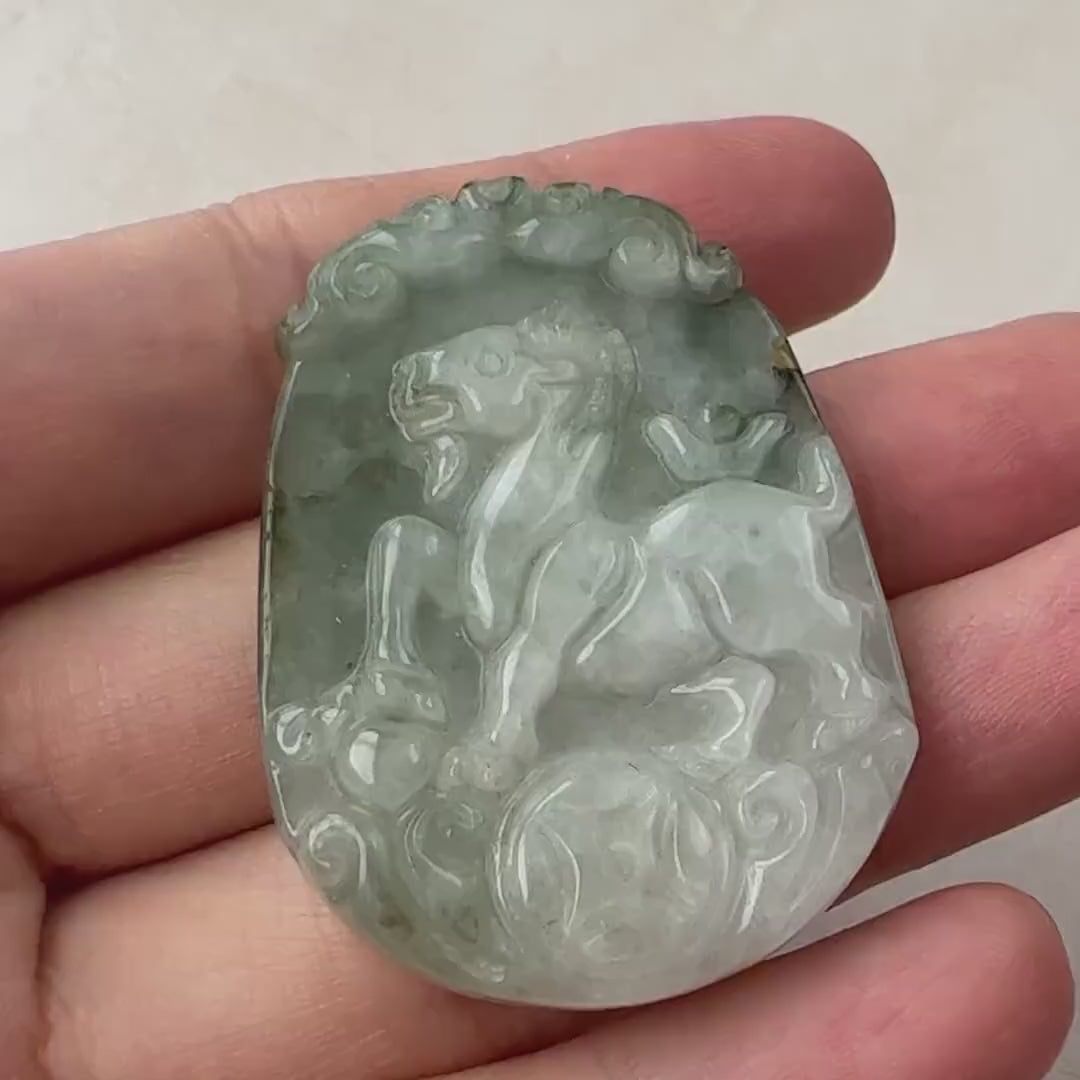 Video of a hand-carved natural jadeite Chinese Zodiac Goat pendant with detailed coin accents and green tones