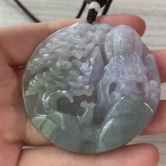 Video of natural jadeite jade pendant with hand-carved Guan Yin over serene mountain landscape, green and detailed