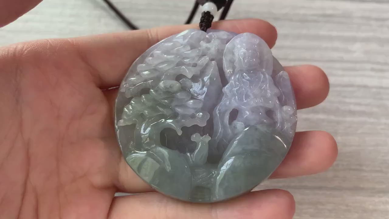Video of natural jadeite jade pendant with hand-carved Guan Yin over serene mountain landscape, green and detailed