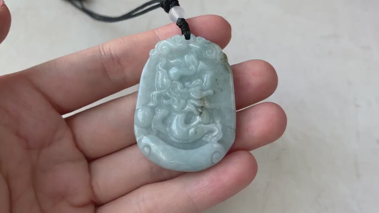 Video of a hand-carved green jadeite dragon pendant with detailed Chinese zodiac style and premium finish