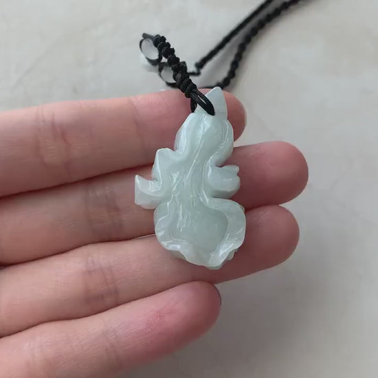 Video of hand-carved natural jadeite jade cabbage pendant in green tones with lifelike details and artisan craftsmanship