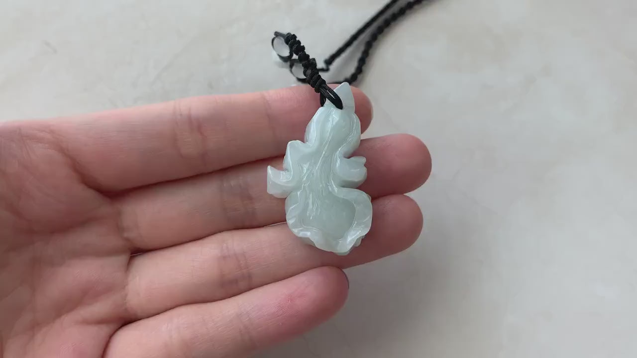 Video of hand-carved natural jadeite jade cabbage pendant in green tones with lifelike details and artisan craftsmanship