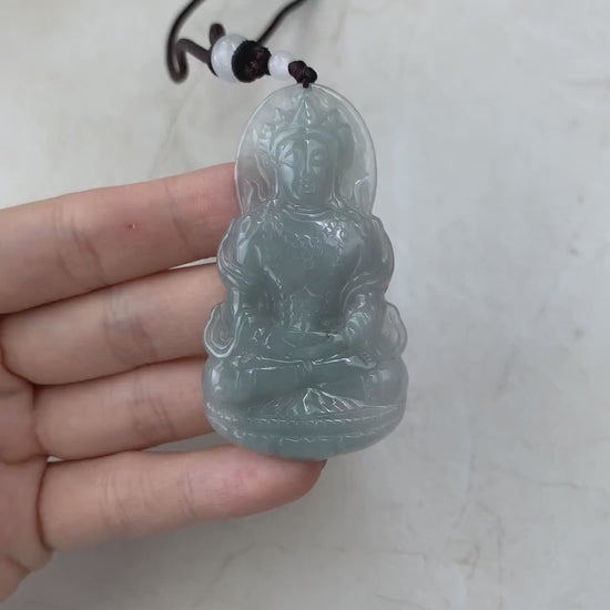 Video of a one-of-a-kind natural jade pendant with hand-carved meditating Guan Yin on a lotus, intricate green detail