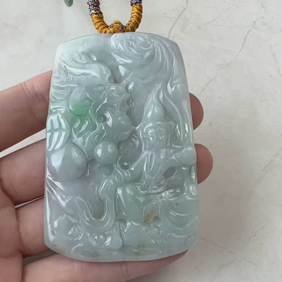 Video of hand-carved green jadeite pendant with bodhisattva and dragon motif, one-of-a-kind spiritual style