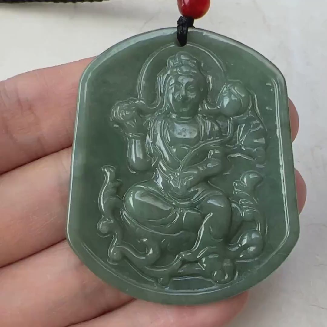 Video of a hand-carved one-of-a-kind jade Guan Yin pendant in serene green, spiritual and elegant style