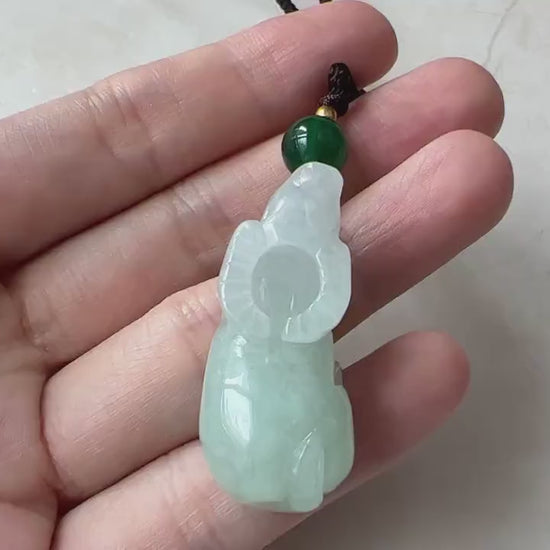 Video of a natural untreated jadeite jade pendant with a finely carved Ox zodiac design, green and elegant