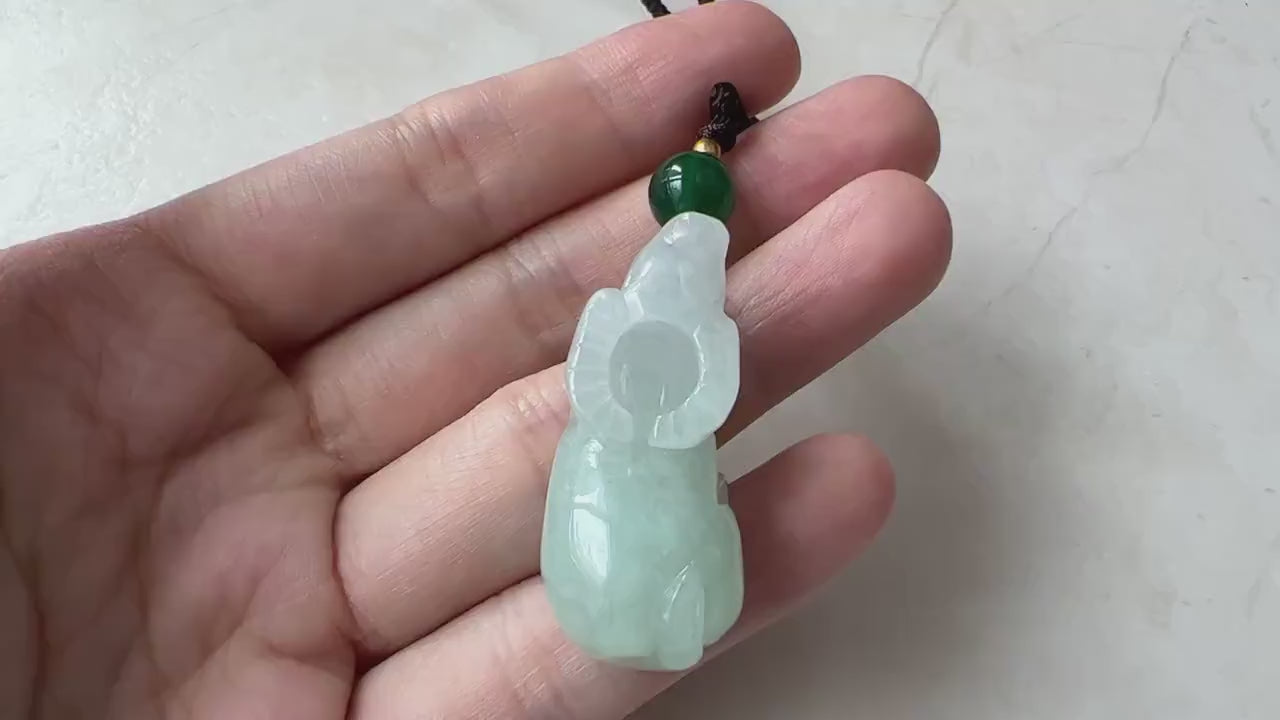 Video of a natural untreated jadeite jade pendant with a finely carved Ox zodiac design, green and elegant