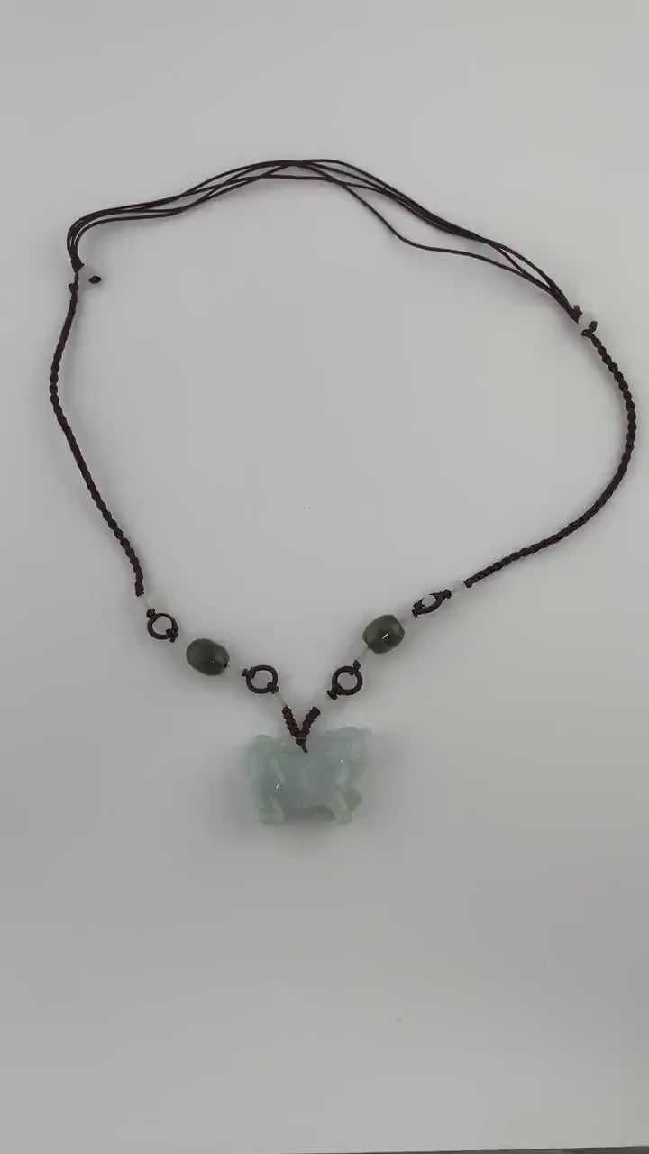 Video of a high-grade natural jade pendant with a 3D hand-carved Qilin, green, intricate and mythical style