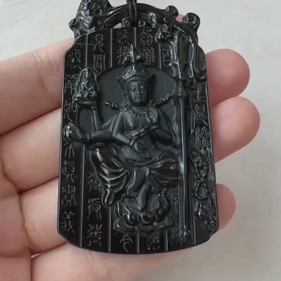 Video of a hand-carved black jadeite pendant with serene Buddha motif and ancient Chinese character accents