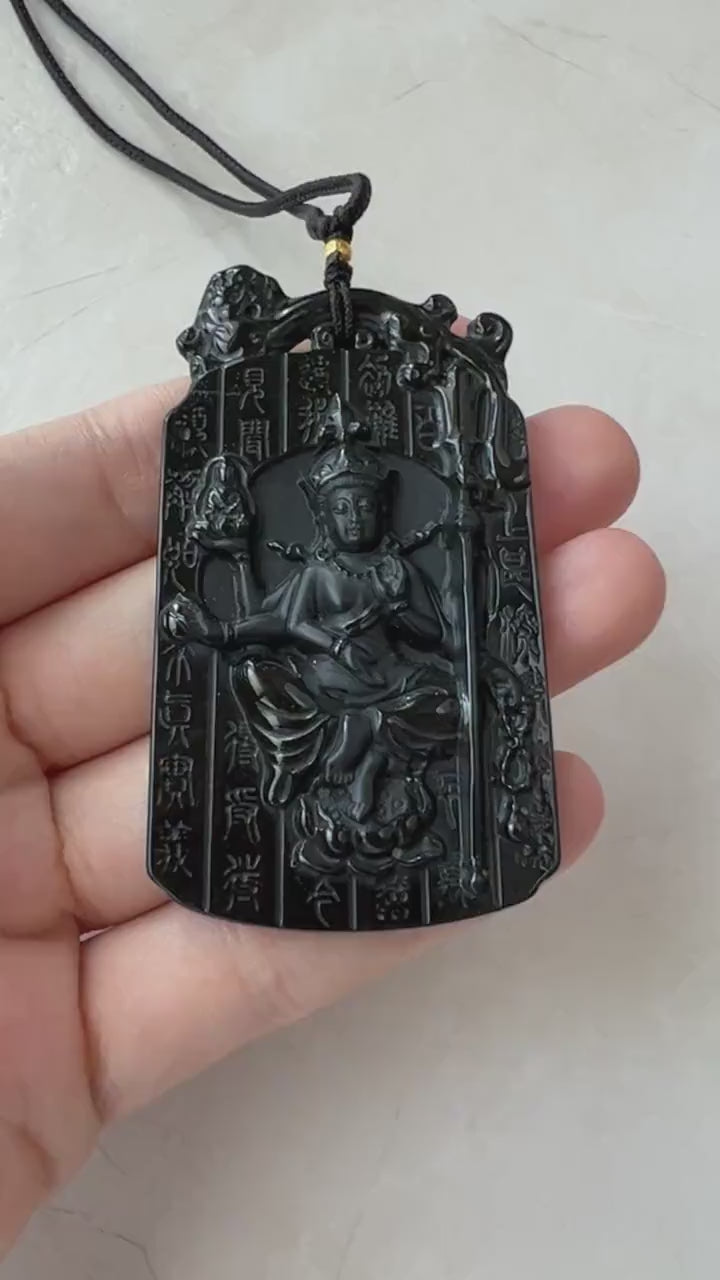 Video of a hand-carved black jadeite pendant with serene Buddha motif and ancient Chinese character accents