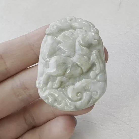 Video of hand-carved jade Horse pendant with Ruyi motif, showcasing natural stone beauty and traditional craftsmanship