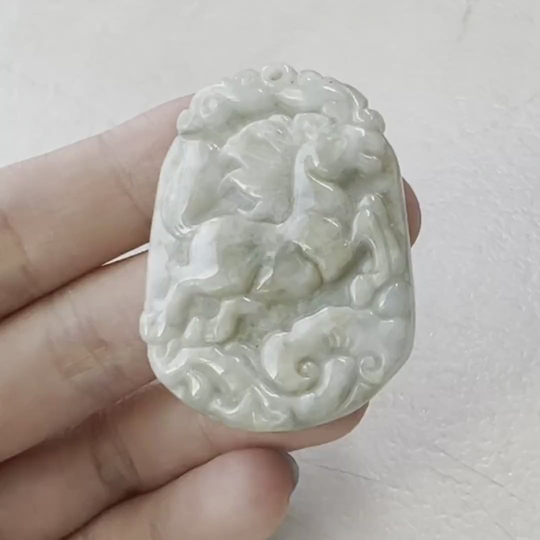 Video of hand-carved jade Horse pendant with Ruyi motif, showcasing natural stone beauty and traditional craftsmanship