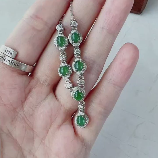 Video of a sterling silver necklace with six semi-translucent green jadeite cabochons, elegant and natural.