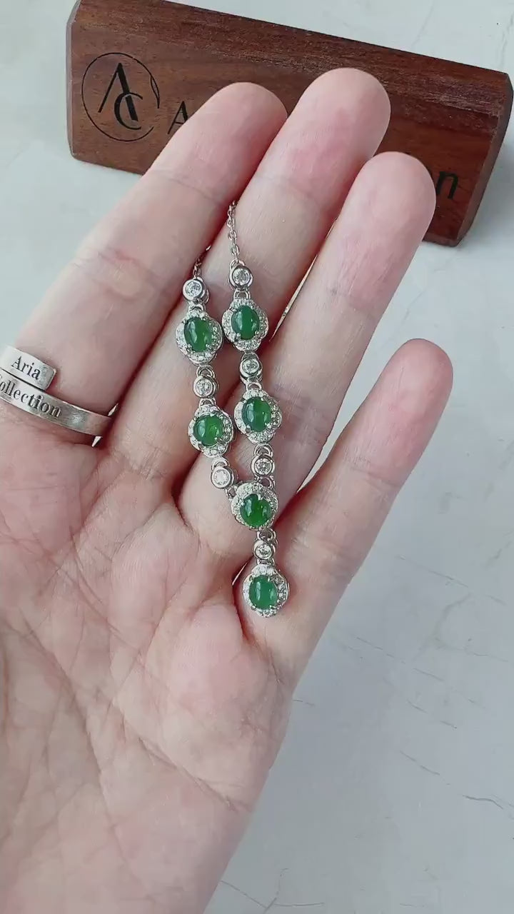 Video of a sterling silver necklace with six semi-translucent green jadeite cabochons, elegant and natural.