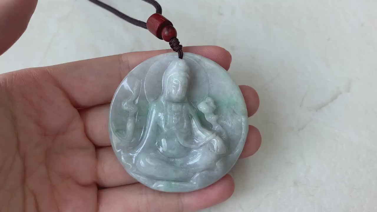 Video of a hand-carved green jade Guan Yin pendant with intricate details and elegant timeless style