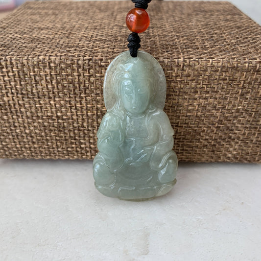 Front view of semi-translucent jadeite Guan Yin carved pendant necklace with polished finish and amber bead accent